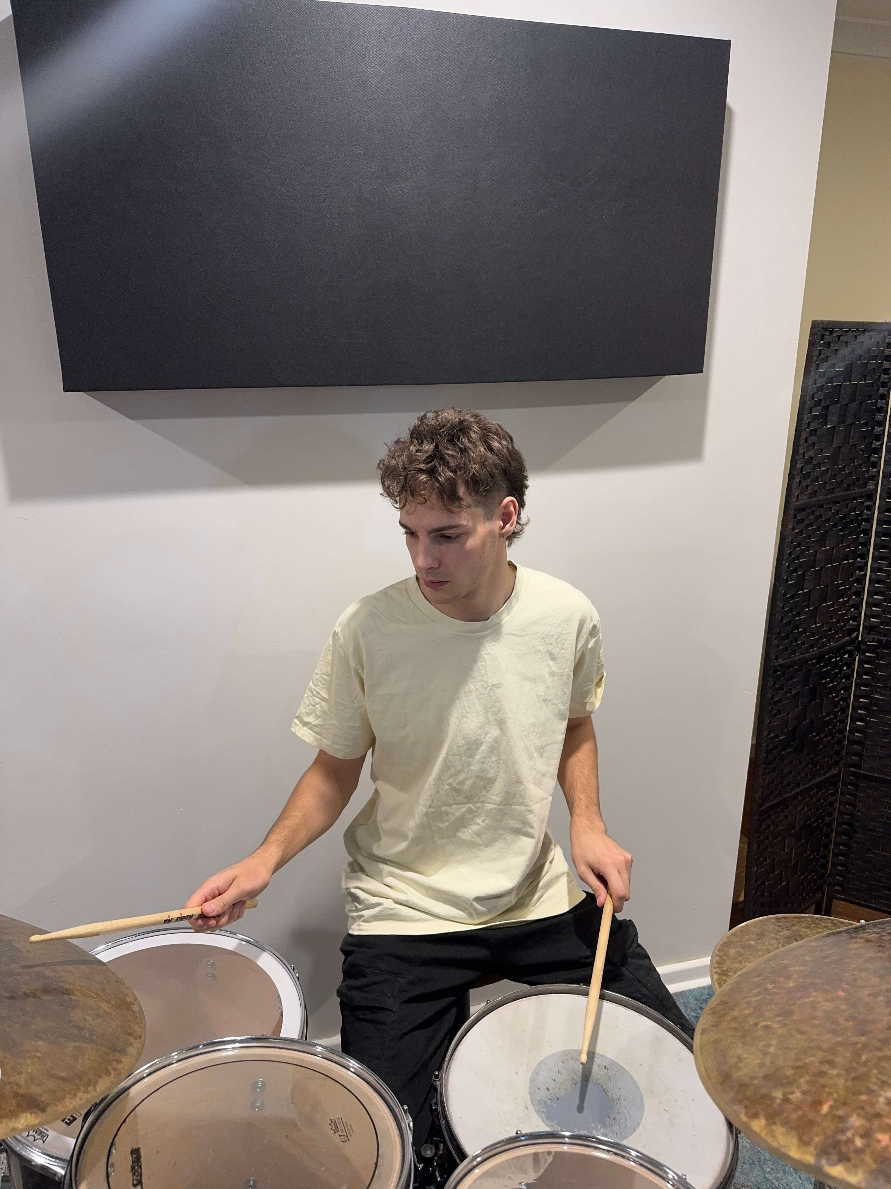 Isaac playing drums